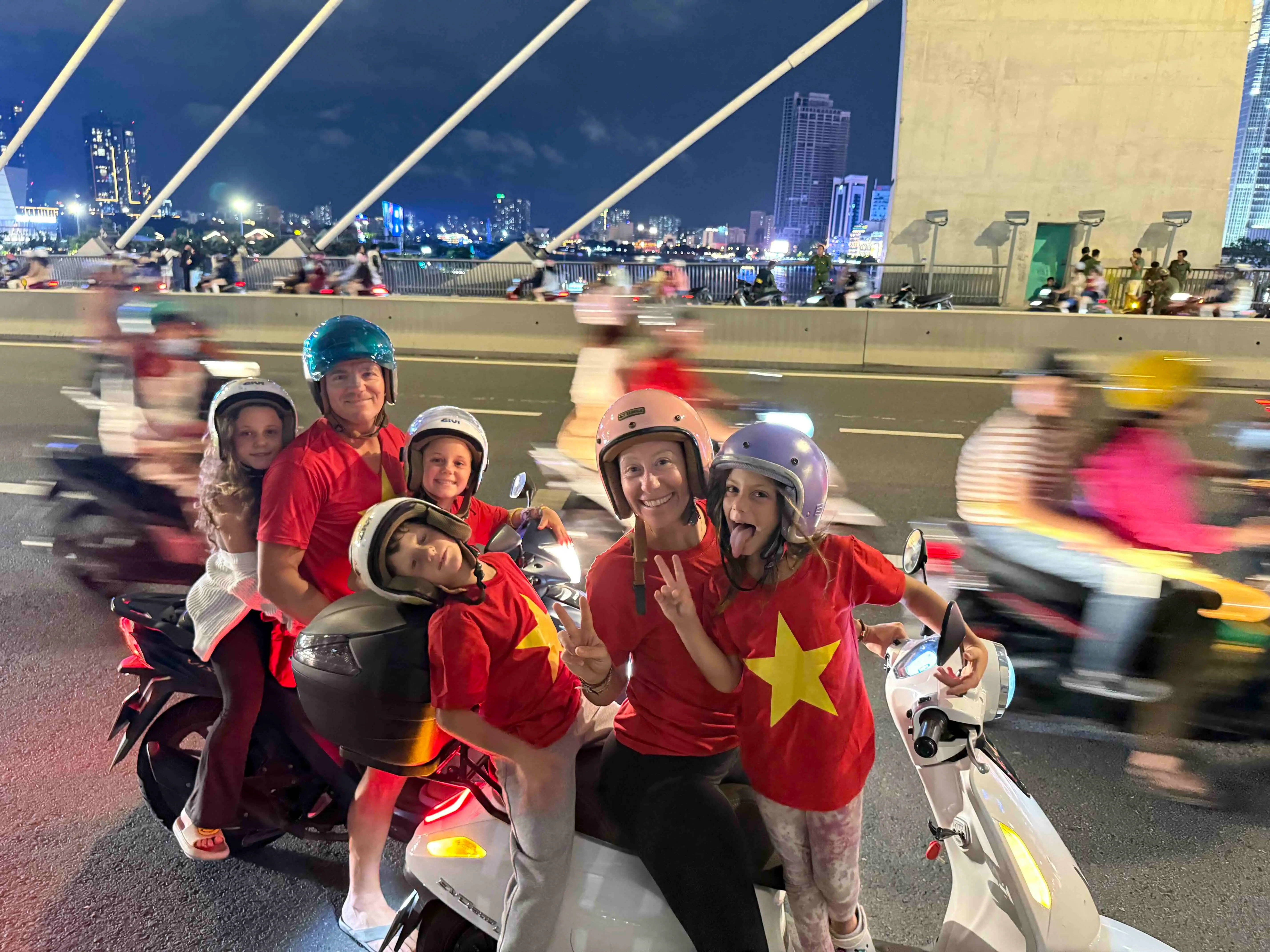 Western family on two motor bikes in Vietnam.