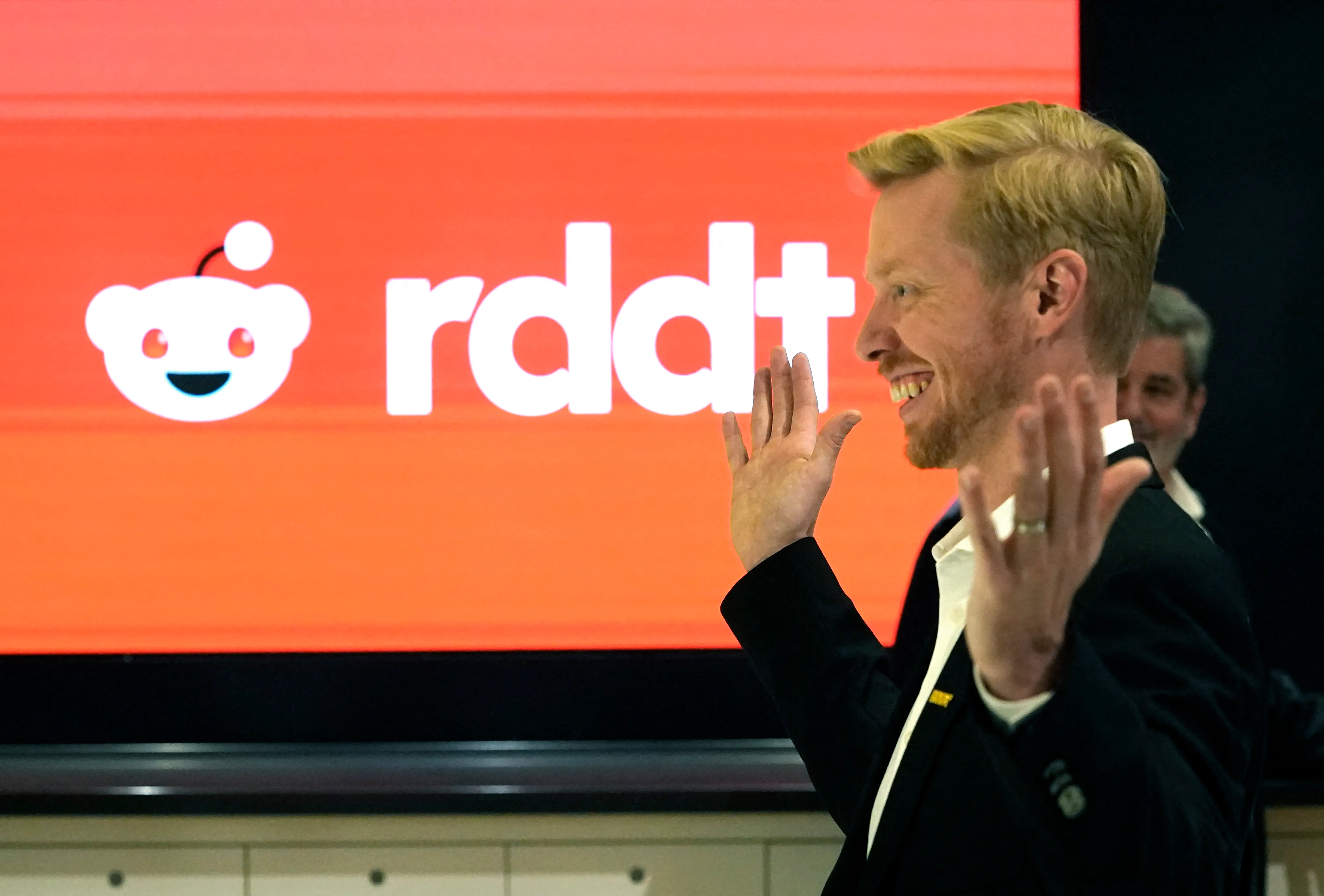 Reddit CEO and co-founder, Steve Huffman, poses for picture before the opening bell as Reddit begins trading on the New York Stock Exchange (NYSE) in New York on March 21, 2024.