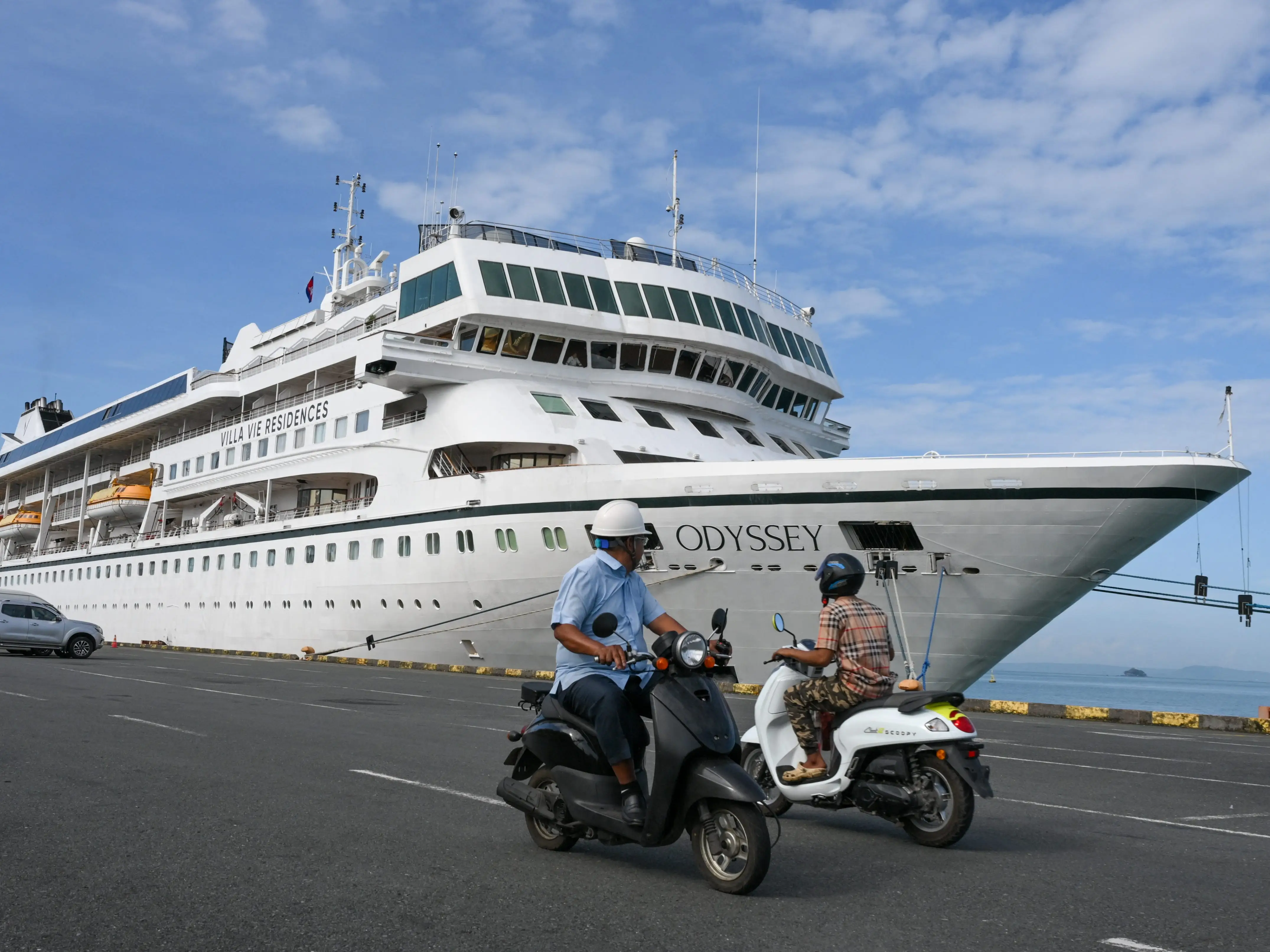 Motorists riding past the Villa Vie Residences' cruise ship Odyssey