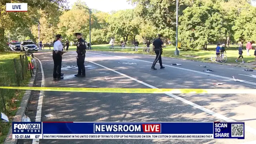 Police officers investigate the scene of a fatal cyclist collision in Central Park.