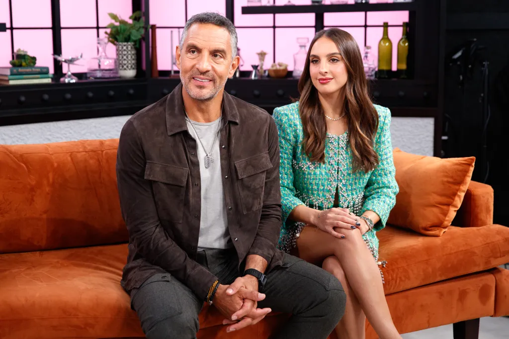 Mauricio Umansky and Alexia Umansky sitting on an orange couch during a Page Six Virtual Reali-Tea interview.