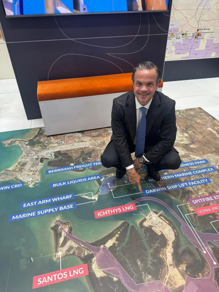 Formentera Partners and Daly Waters founder Bryan Sheffield crouches over a map of the liquefied natural gas export facilities in Australia that gas from the Beetaloo Basin could service.