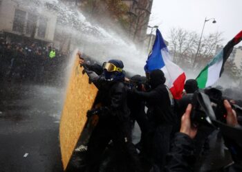 French protests draw hundreds of thousands under tight security and rain