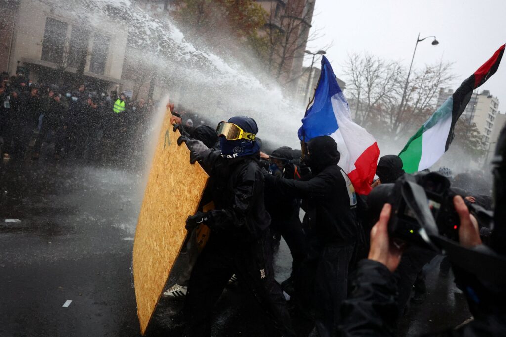 French protests draw hundreds of thousands under tight security and rain