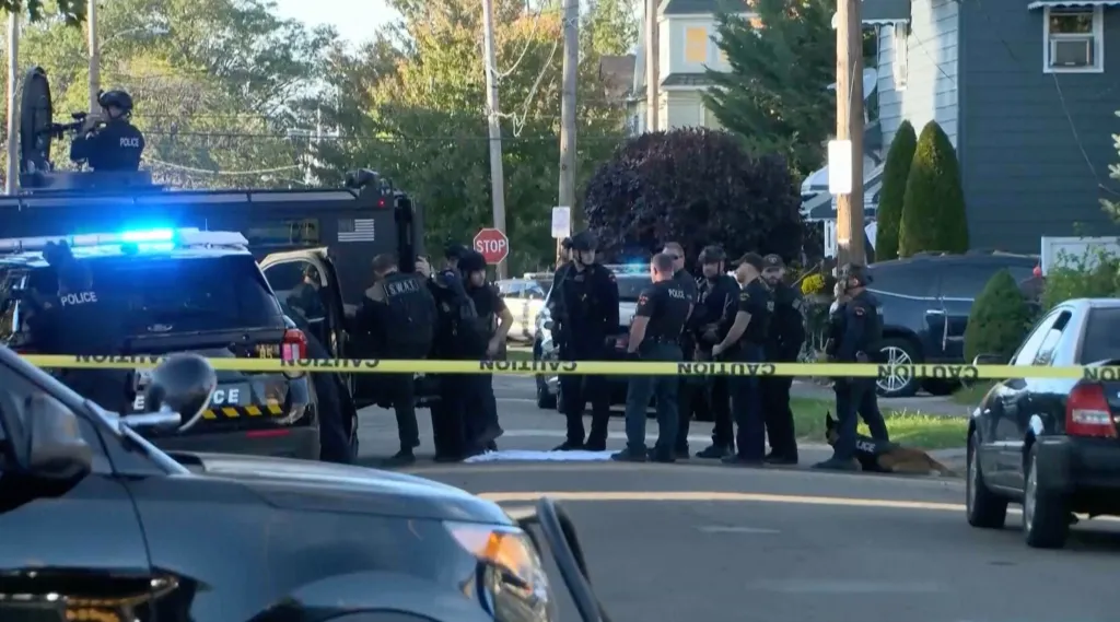 Police officers and an armored vehicle at the scene of a shooting in Pennsylvania.