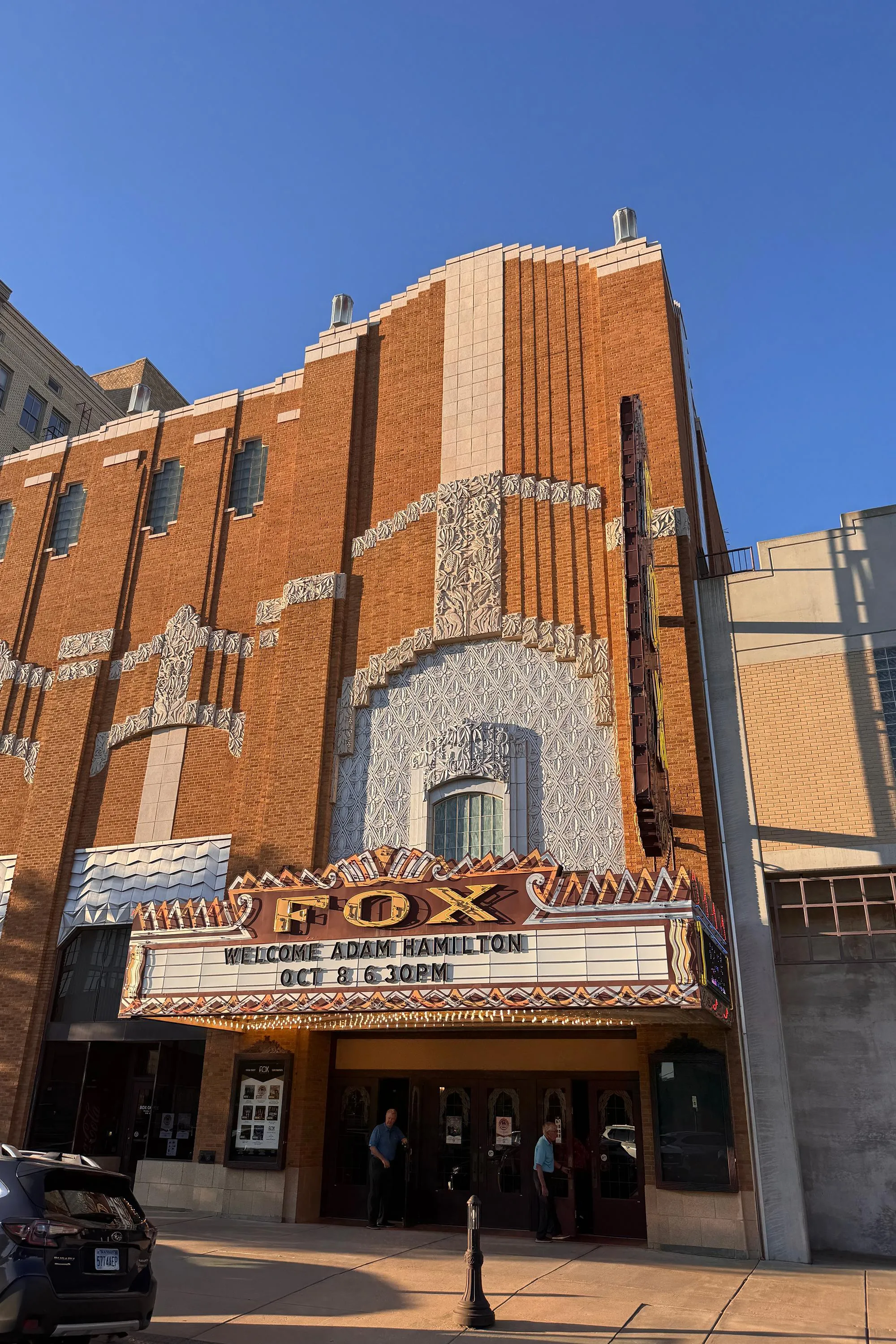 an image of an old brick movie theater facade that reads “Fox” an image of an old brick movie theater facade that reads “Fox”