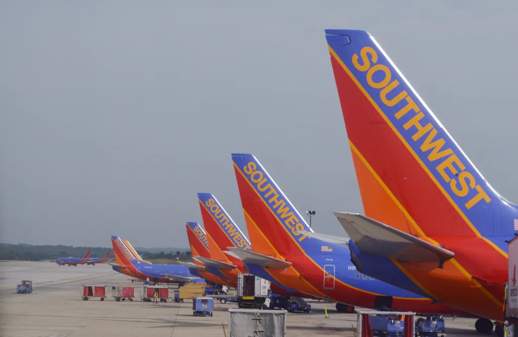 A line of Southwest Airlines airplanes parked at Fort Lauderdale International Airport.