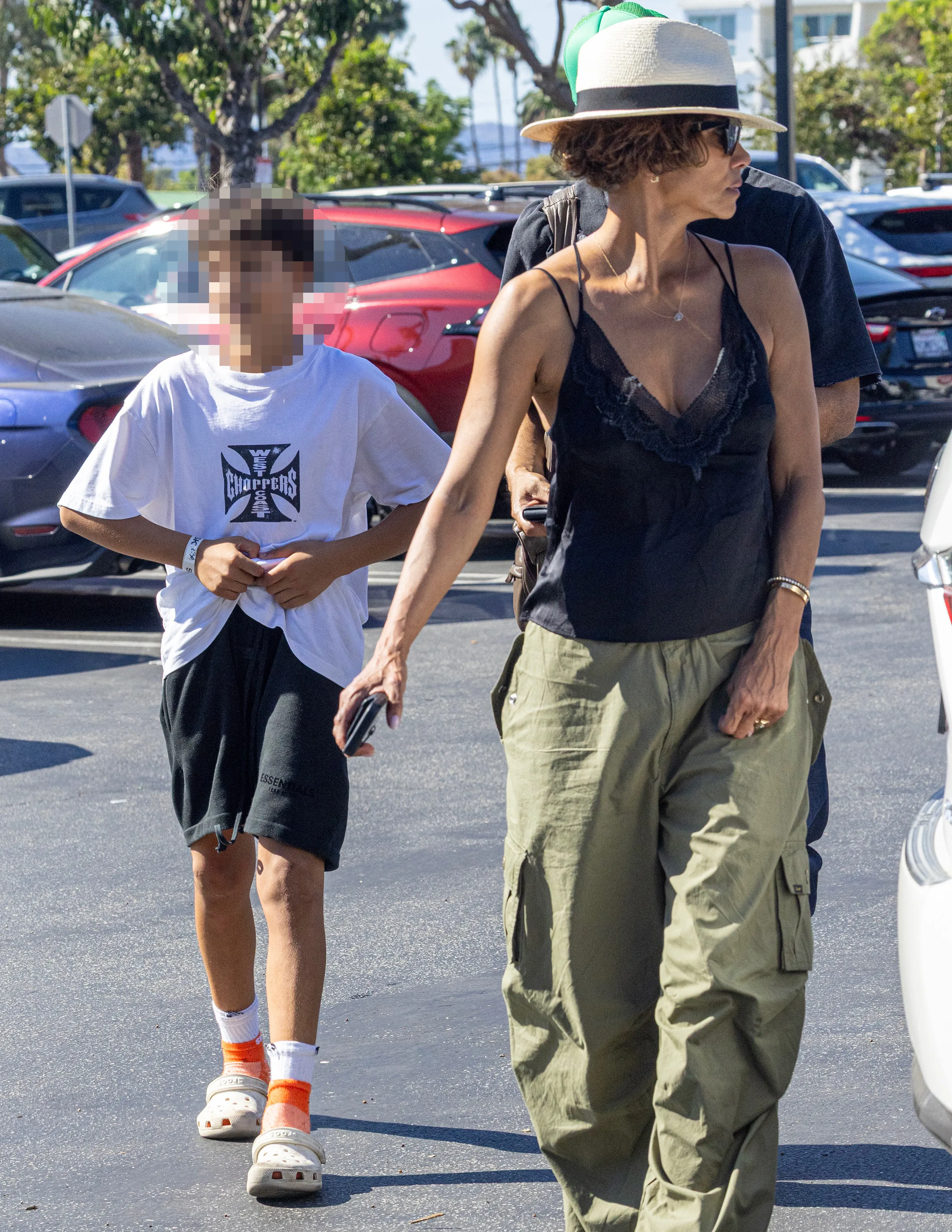 Halle Berry walking in a parking lot with her son Maceo.