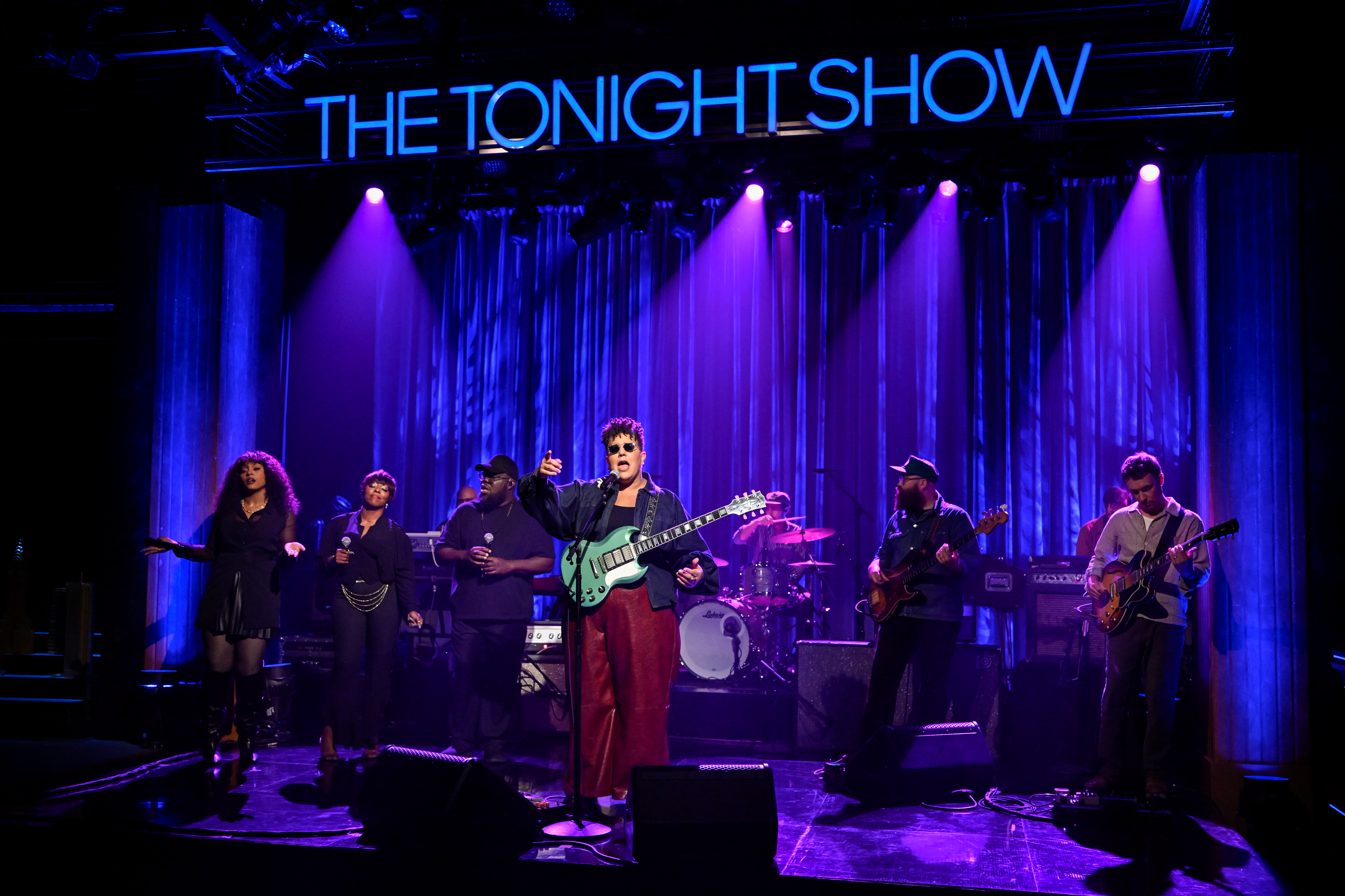 Alabama Shakes performs on stage under purple stage lights with 