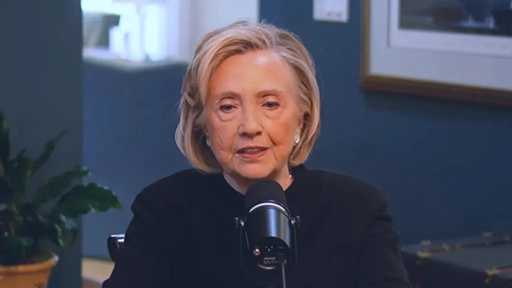 Hillary Clinton speaking into a microphone.