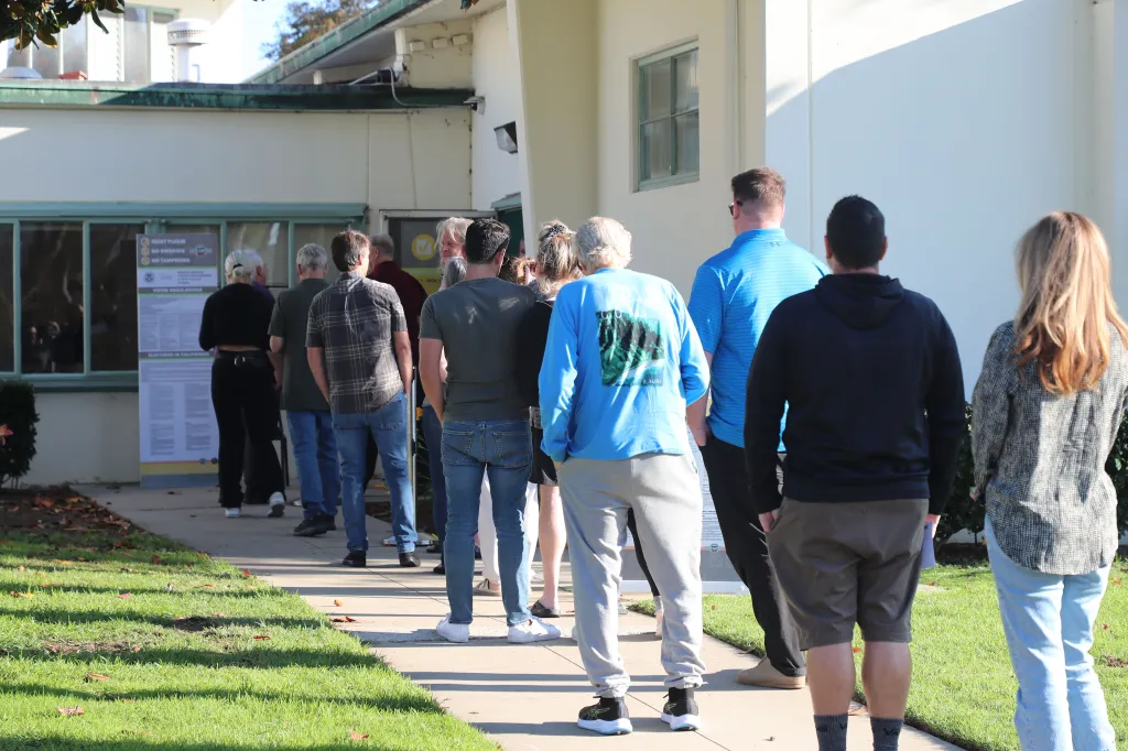 Voters line up outside the Huntington Beach Library in California.