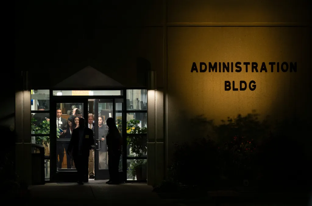 Witnesses to the attempted execution of Christa Pike exit the administration building at Riverbend Maximum Security.