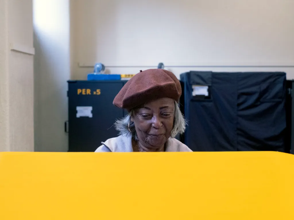 A voter in the Pacific Palisades district filling out a ballot.
