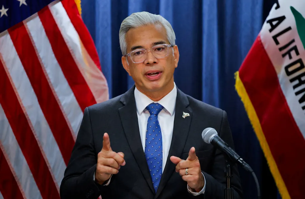 California Attorney General Rob Bonta speaks at a press conference, gesturing with both hands.