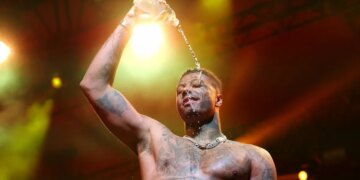 Rapper Arrested While Wearing Superhero Costume After Fake Gun Call