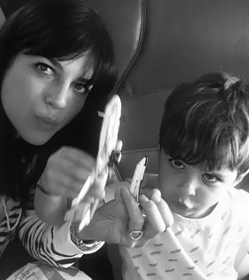 Selma Blair and her son on a flight playing with toys.