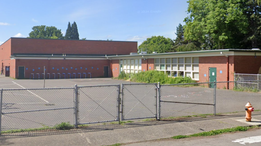 Roberts' ban from Meriwether Lewis Elementary School was lifted after the Portland Public Schools agreed to several concessions.