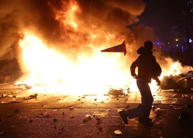 Destructive protests sweep across France, with buildings burned and hundreds detained
