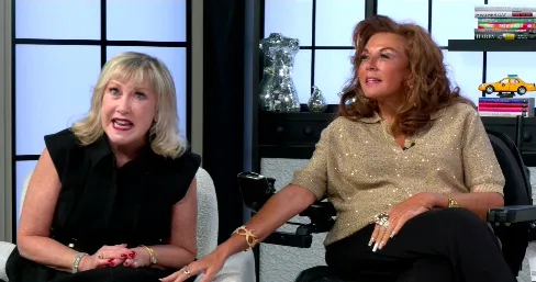 Abby Lee Miller and Cathy Nesbitt-Stein sitting together in a room.