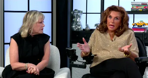 Abby Lee Miller and Cathy Nesbitt-Stein sitting in chairs and talking.