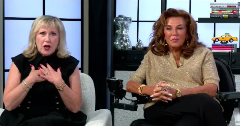 Abby Lee Miller and Cathy Nesbitt-Stein sit next to each other on a set.