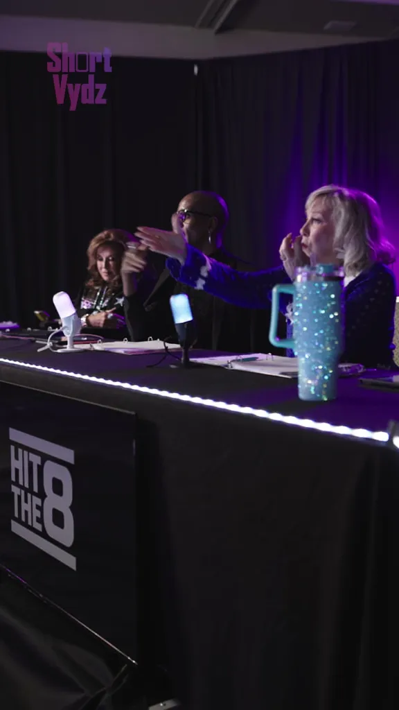 Abby Lee Miller and Cathy Nesbitt-Stein sitting at a judges' table with a