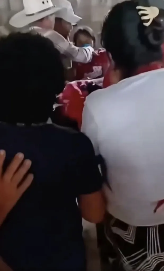 Confused family members couldn’t believe their eyes as the teen, dressed in a pink T-shirt, suddenly shot up and started speaking.