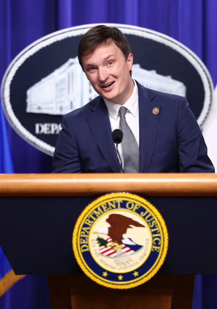 Acting US Deputy Attorney General Trent McCotter speaks at a press conference at the Department of Justice.