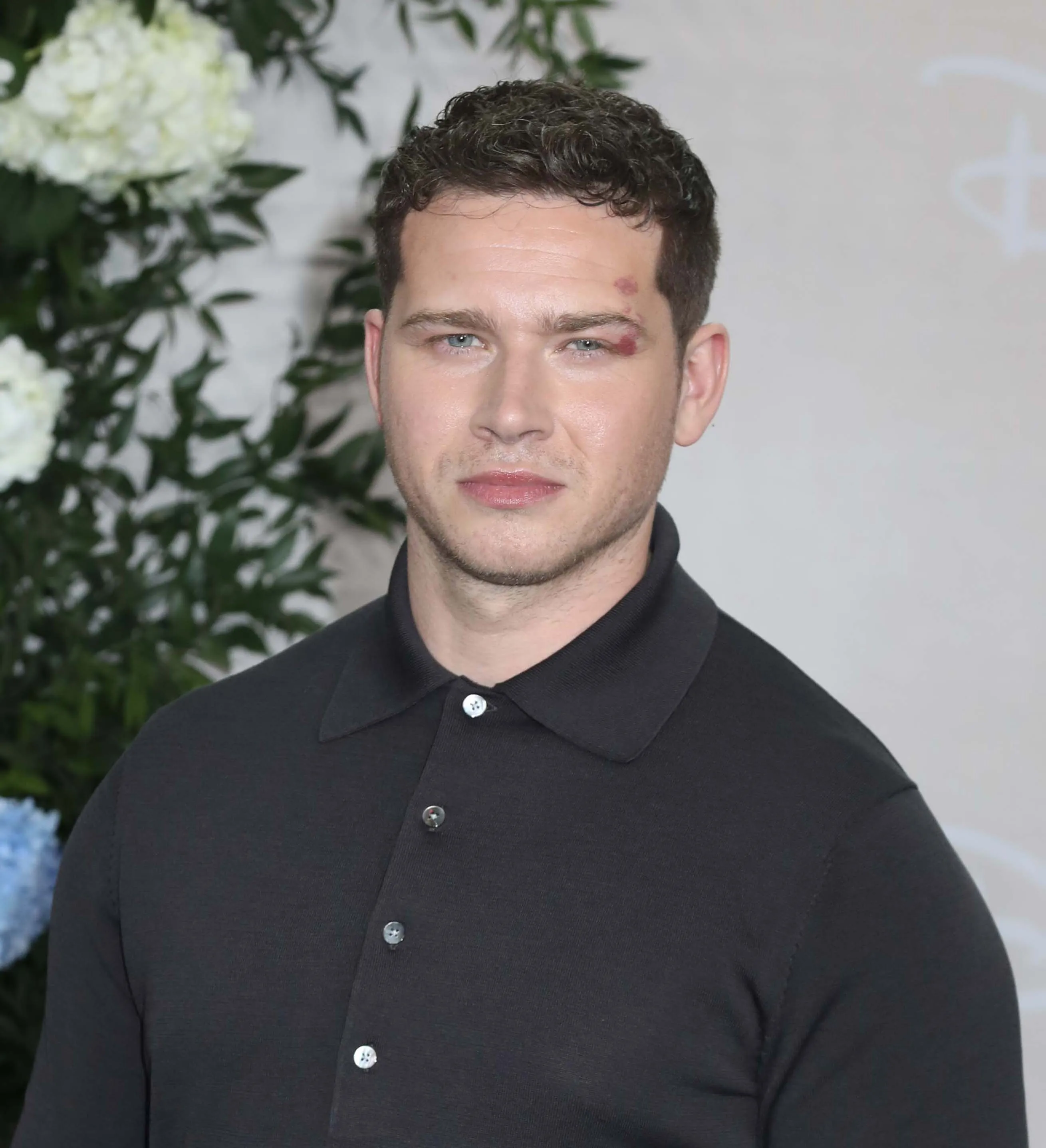 Actor Oliver Stark posing at Disney's 2025 Upfront.
