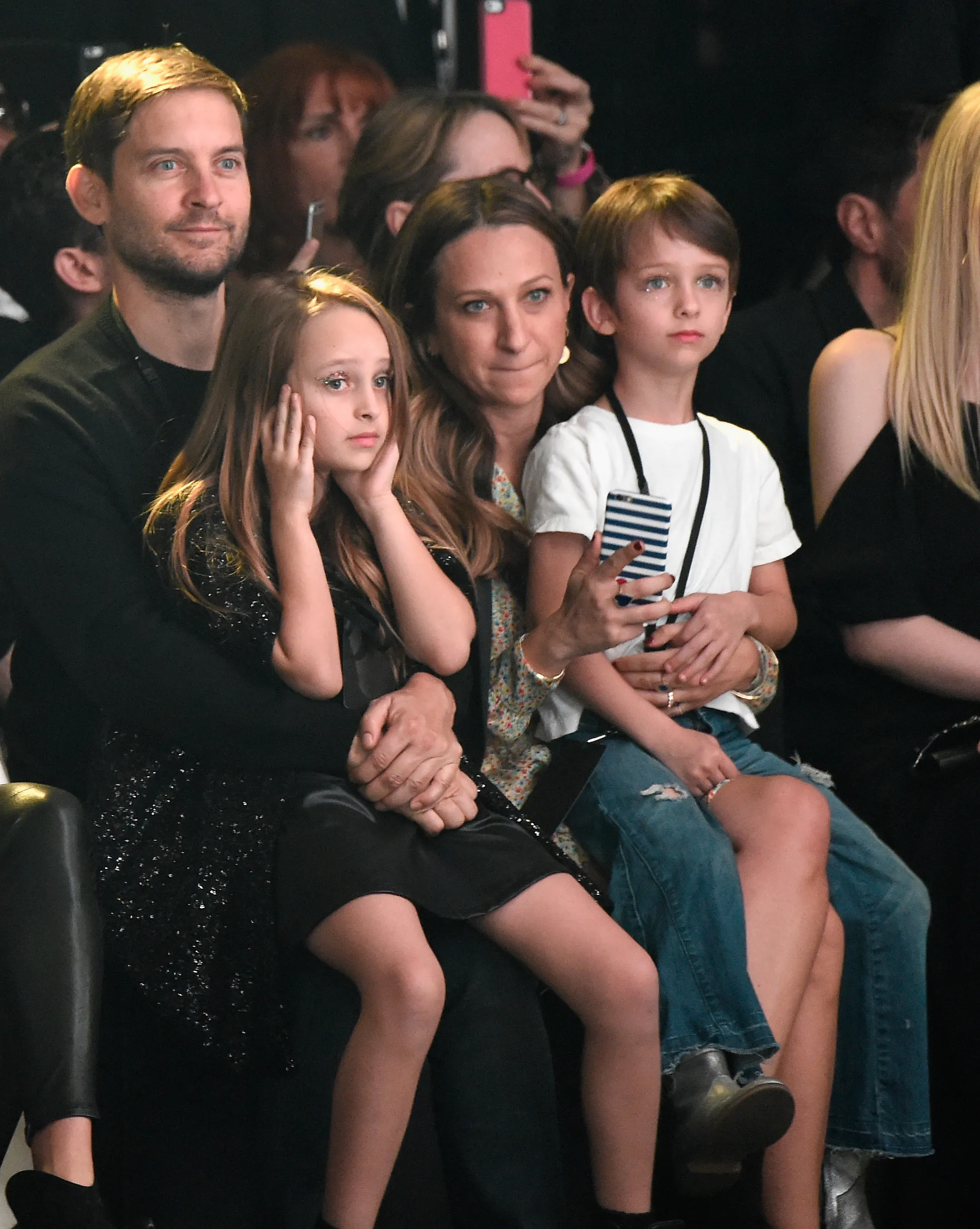 Actor Tobey Maguire, Ruby Maguire, and designer Jennifer Meyer attending a show.