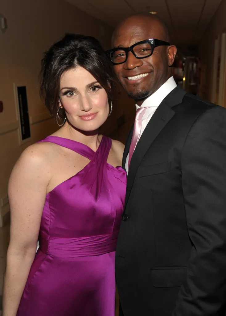 Actors Idina Menzel and Taye Diggs pose together.