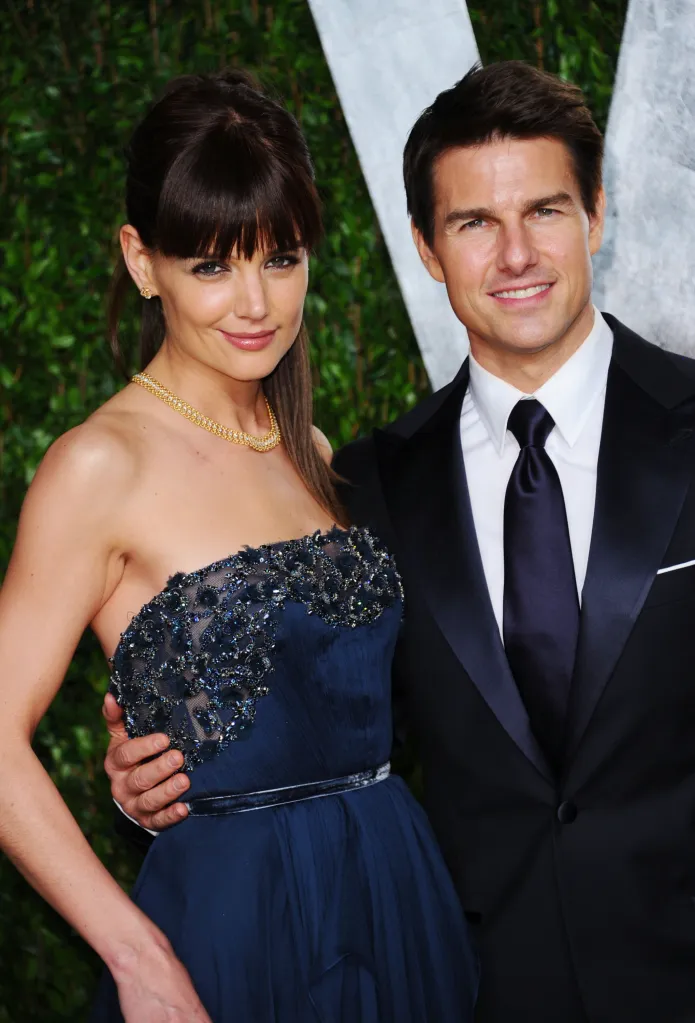 Actors Katie Holmes and Tom Cruise arrive at an Oscar party.