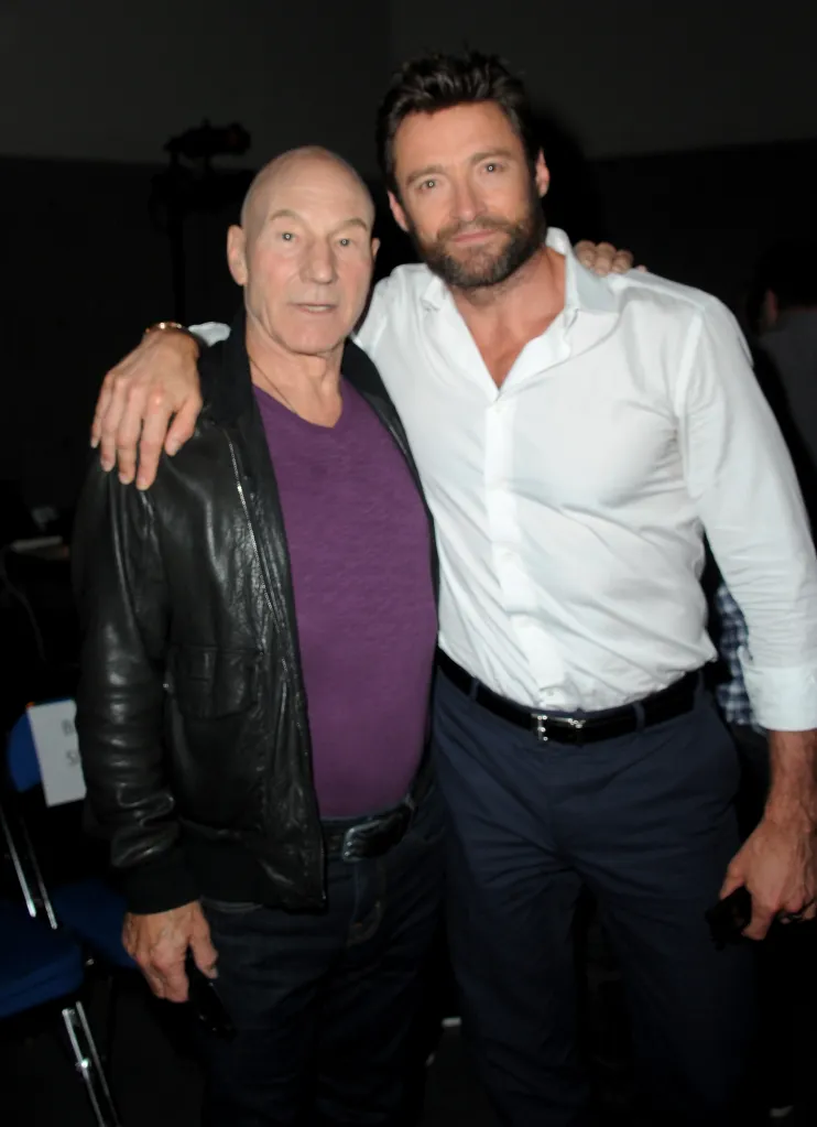 Actors Patrick Stewart and Hugh Jackman stand together, with Jackman's arm around Stewart's shoulder.