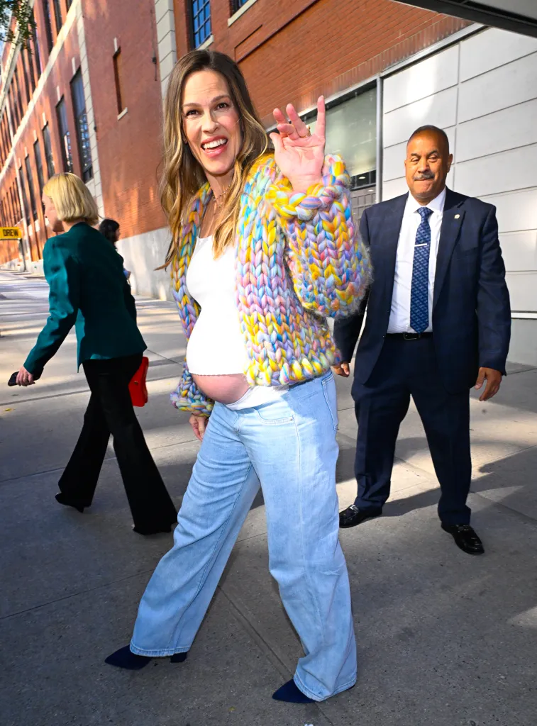 Hilary Swank waving while leaving the 