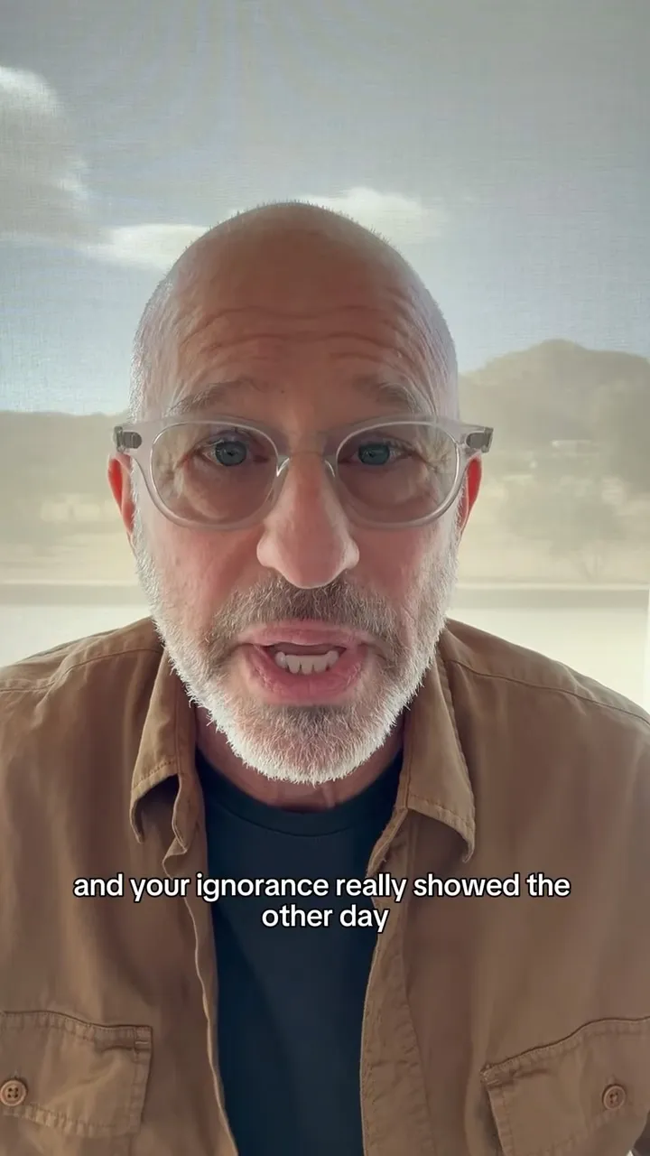 Rabbi Matt Miro speaks to the camera in a video still, with captions reading 
