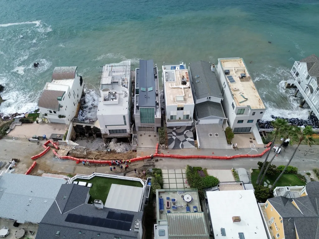 Aerial view of a sinkhole by a beachfront mansion in Malibu.