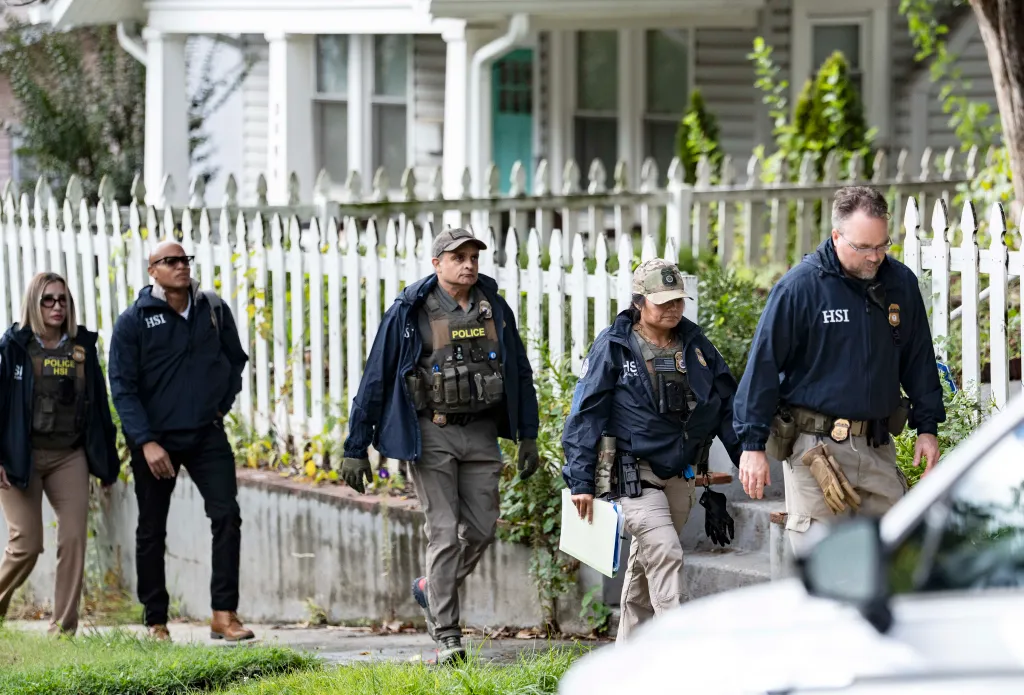 Homeland Security Investigations agents leave the Washington, D.C., home of U.S. Rep. Ilhan Omar.