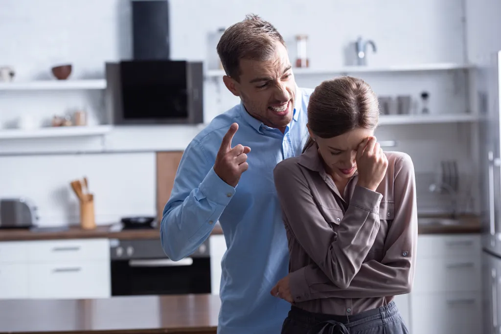 An aggressive man screams at his crying wife during a quarrel on Thursday, August 8, 2019.