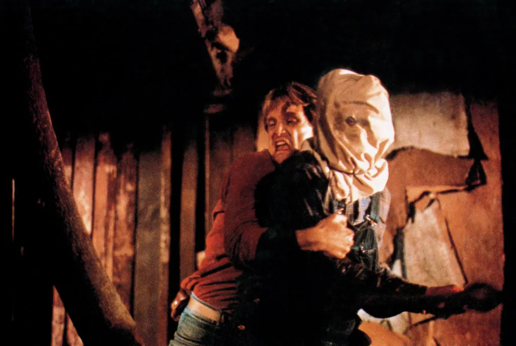 John Furey struggles with a hooded maniac in a scene from 