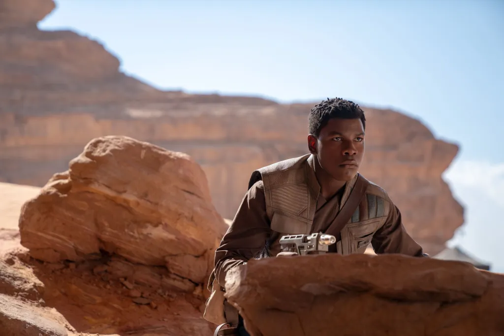 John Boyega as Finn in a desert scene from Star Wars: The Rise of Skywalker.
