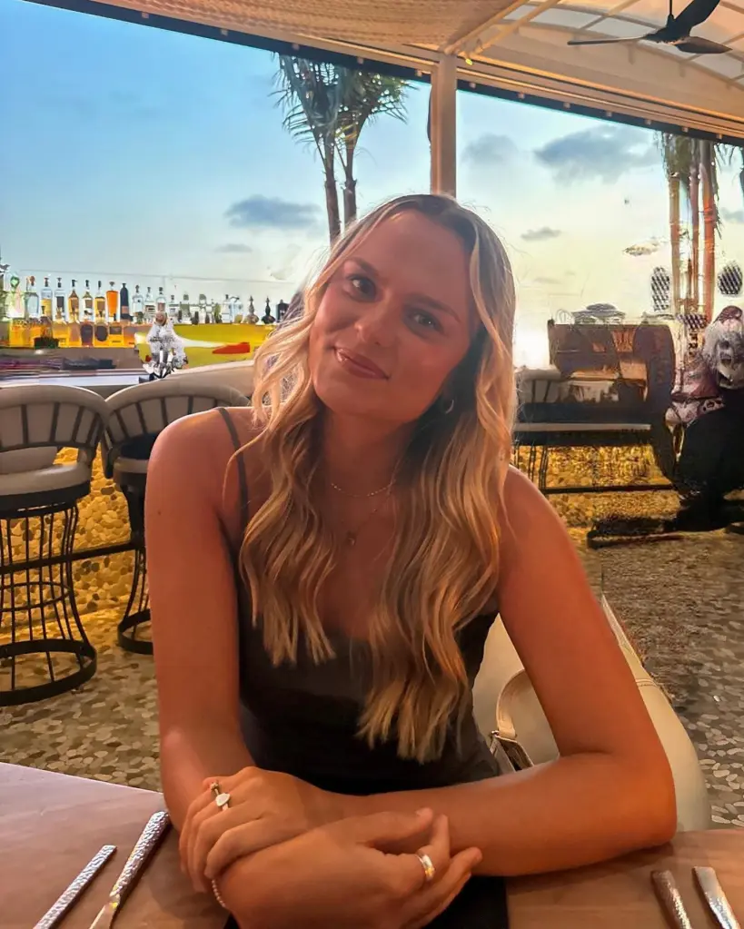 Portrait of Alana Nielson sitting at an outdoor bar.