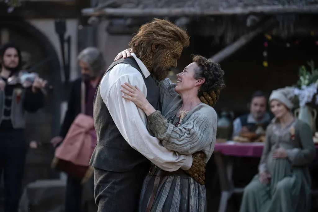 Alexander Skarsgard and Olivia Colman embrace in a scene from 