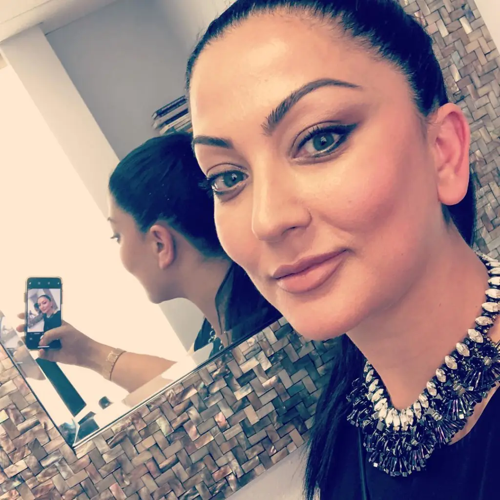 Dr. Violetta Mailyan taking a selfie in a mirror.