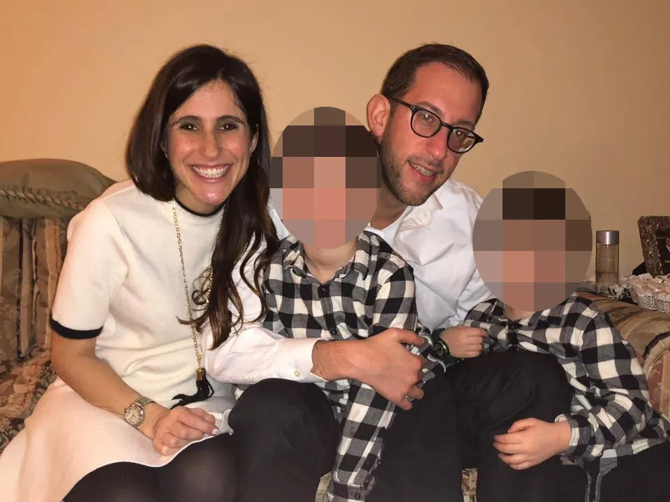 Allison Rahmani poses for a photo with her husband, Matthew, and two of their children.