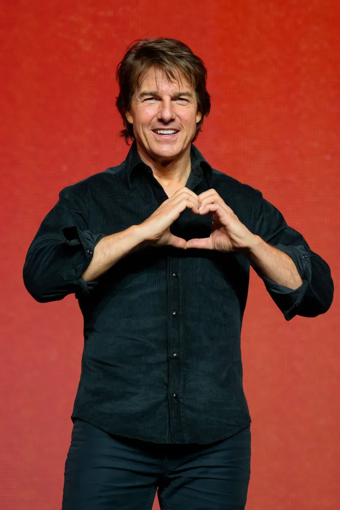 Tom Cruise making a heart sign with his hands at the 'Digger' film press conference in Seoul, South Korea.