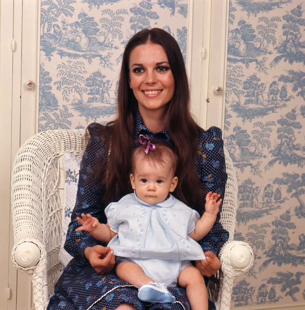 American actress Natalie Wood holding her baby daughter Natasha Gregson Wagner.