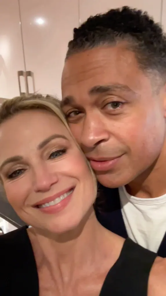 Amy Robach and T.J. Holmes posing for a selfie.