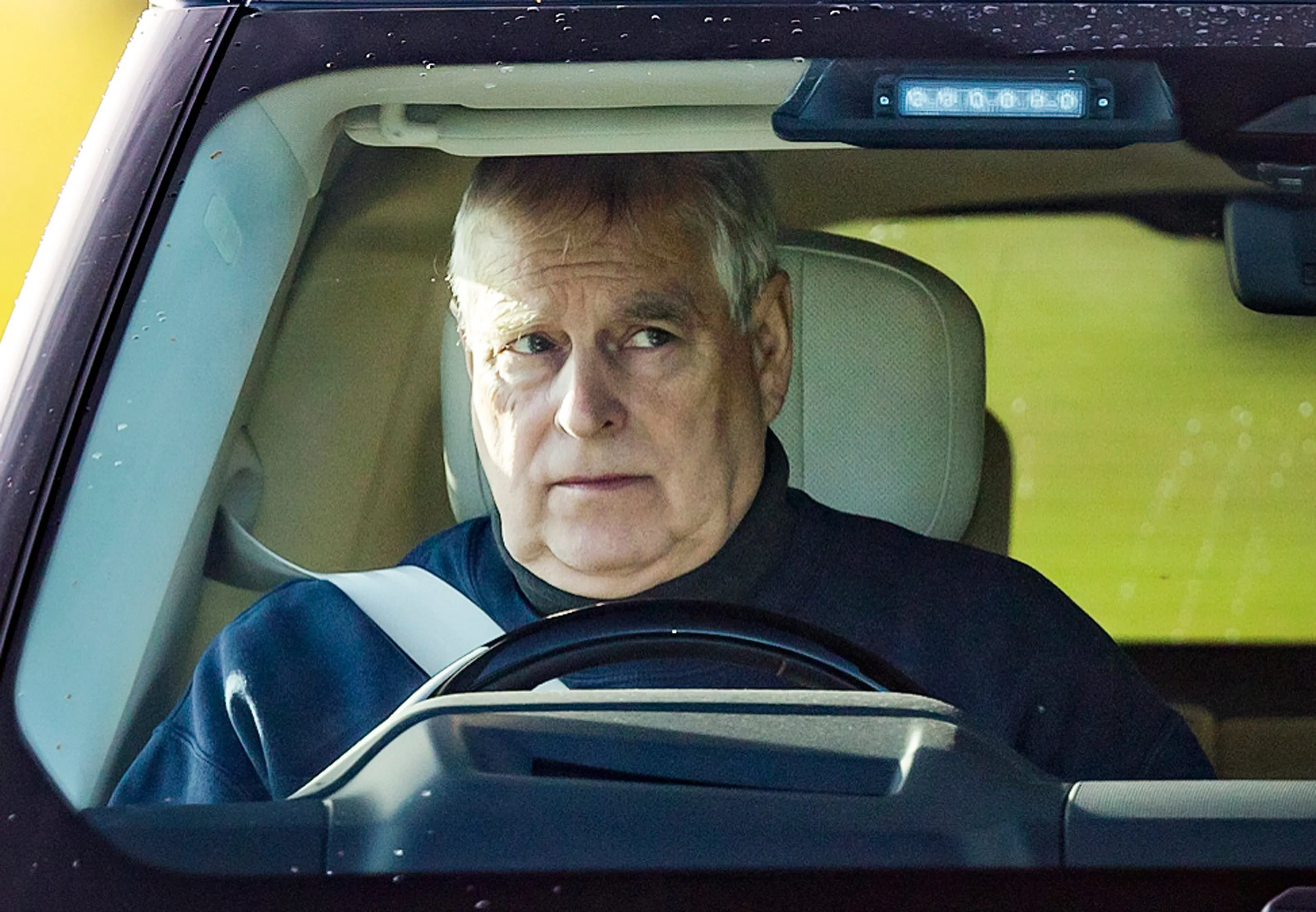 Andrew Mountbatten-Windsor driving a car in Windsor.