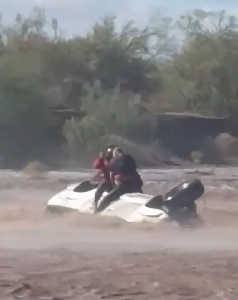 Maricopa County Sheriff's Office said its Fox 1 aviation crew responded Tuesday morning to a flooded wash in Tonopah, where deputies found the man sitting atop the overturned vehicle.
