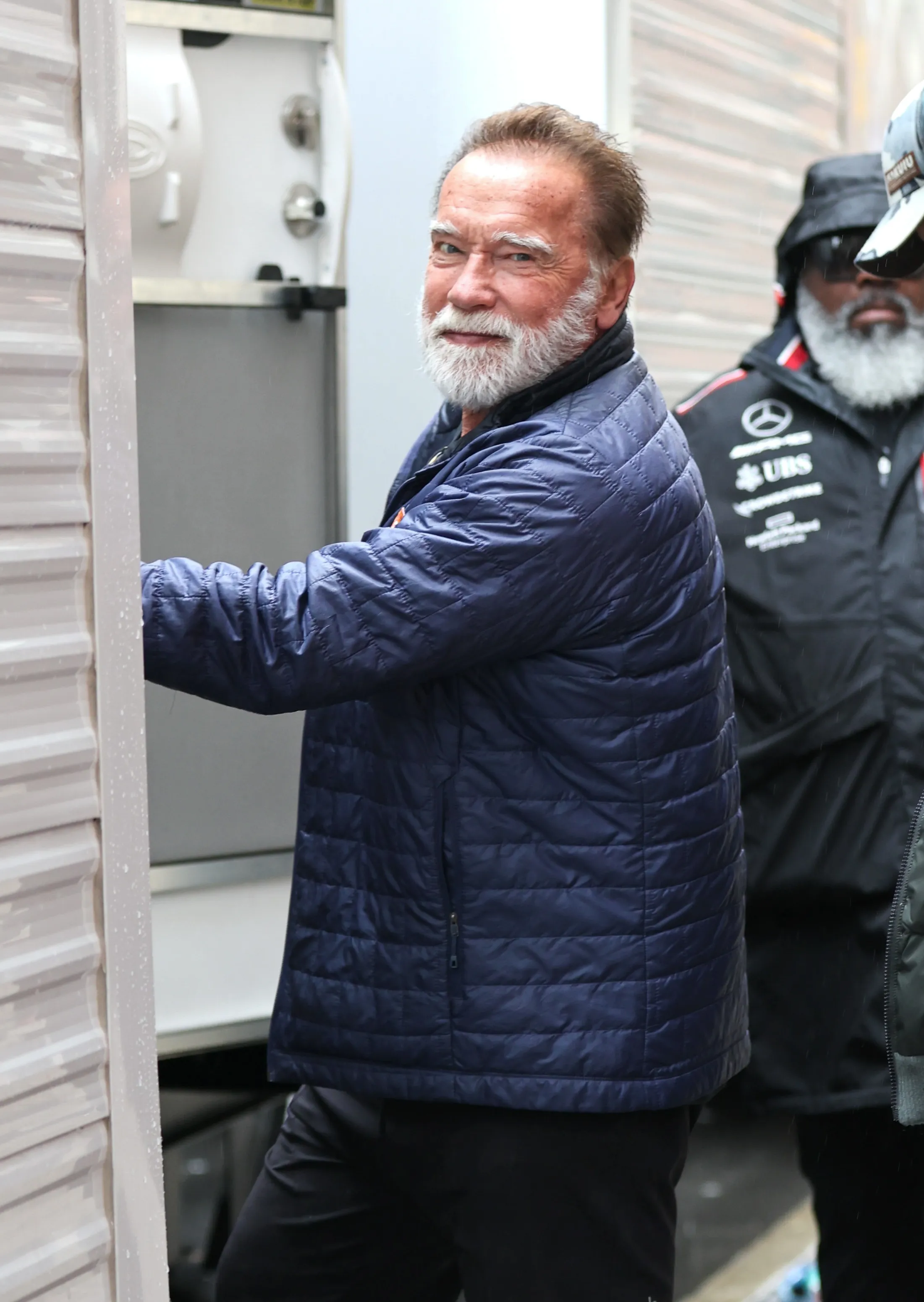 Arnold Schwarzenegger with a white beard is seen on the set of the film 'The Man with the Bag'.